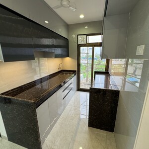 Kitchen in 1 BHK Apartment at Satyam Paradise, Ulwe Sector 18 – for Sale