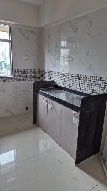 Kitchen in 2 BHK Apartment at DGS Sheetal Tapovan, Malad East – for Rent