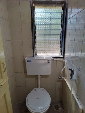Bathroom in 1 BHK Apartment at Kirtikar CHS, Ganeshwadi – for Sale
