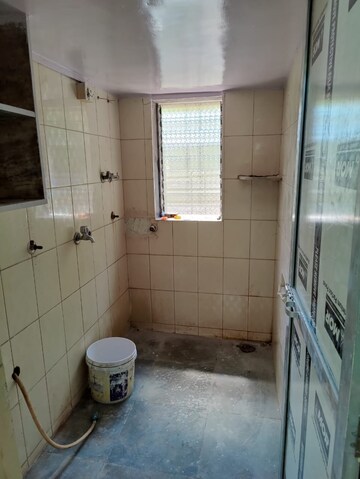 Bathroom in 1 BHK Apartment at Kirtikar CHS, Ganeshwadi – for Sale