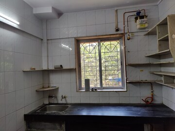 Kitchen in 1 BHK Apartment at Kirtikar CHS, Ganeshwadi – for Sale