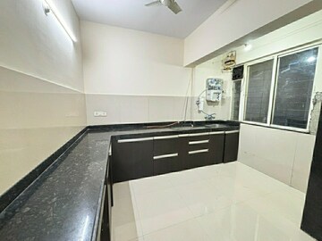 Kitchen in 2 BHK Apartment at Bramha Skycity Apartment, Dhanori – for Rent