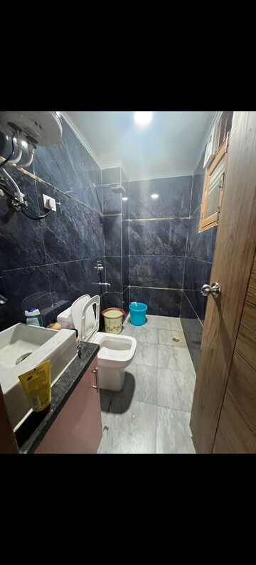 Bathroom in 3 BHK Builder Floor at Freedom Fighters Enclave – for Rent