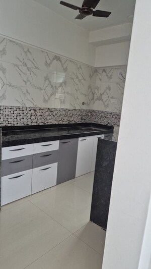 Kitchen in 1 BHK Apartment at Lalani Grandeur, Goregaon East – for Sale