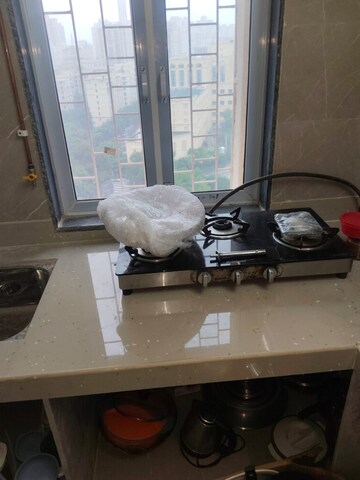 Kitchen in 1 BHK Apartment at Cosmos Classique, Ghodbunder Road – for Sale
