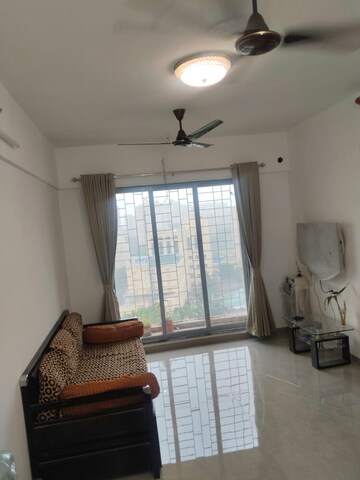 Living Room in 1 BHK Apartment at Cosmos Classique, Ghodbunder Road – for Sale