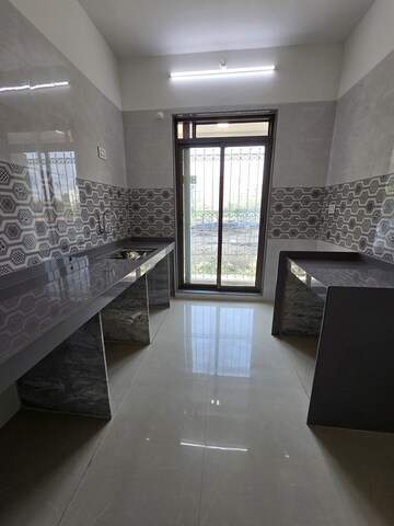 Kitchen in 1 BHK Apartment at Nirvana Gardens, Khadakpada – for Sale