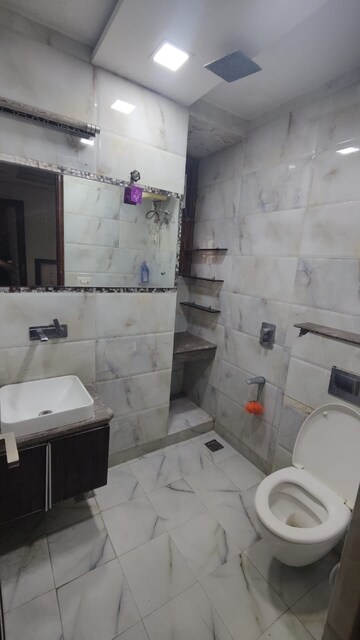 Bathroom in 3 BHK Apartment at Rohini Sector 13 – for Rent