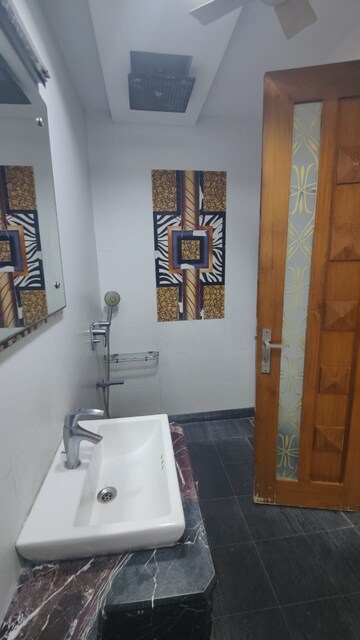 Bathroom in 3 BHK Apartment at Rohini Sector 13 – for Rent