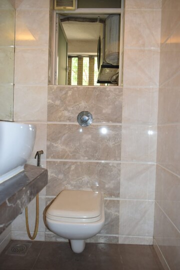 Bathroom in 4 BHK Apartment at Urvashi Terraces, Khar West – for Sale