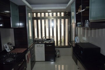Kitchen in 4 BHK Apartment at Urvashi Terraces, Khar West – for Sale
