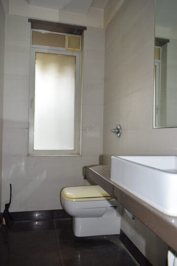 Bathroom in 4 BHK Apartment at Urvashi Terraces, Khar West – for Sale
