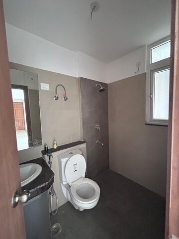 Bathroom in 3 BHK Apartment at ATS Homekraft Pious Hideaways, Sector 150 – for Rent