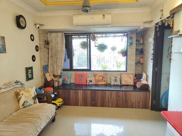 Living Room in 1 BHK Apartment at Lokpuram CHS, Vasant Vihar – for Sale