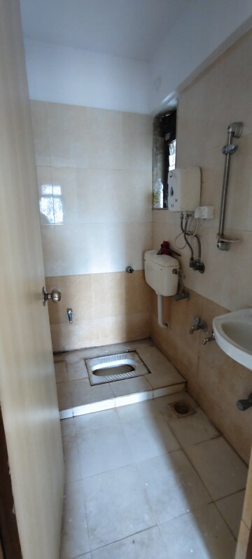 Bathroom in 1 BHK Apartment at Raunak Unnathi Greens, Kasarvadavali – for Rent