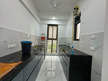 Kitchen in 1 BHK Apartment at Raymond Realty Phase II, Swastik Garden – for Rent