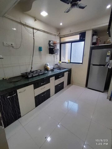 Kitchen in 2 BHK Apartment at Arihant Plaza CHS, Owale – for Rent