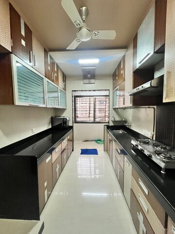 Kitchen in 3 BHK Apartment at Raheja Tipco Heights, Malad East – for Rent