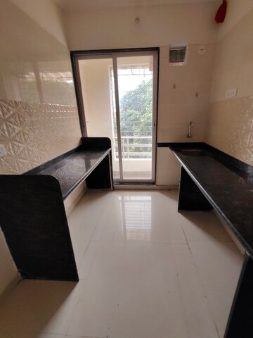 Kitchen in 2 BHK Apartment at Om Shree Sai Woodside Meadows, Kalyan West – for Rent