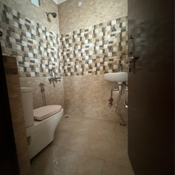 Bathroom in 2 BHK Apartment at Palm Residency Chhatarpur, Rajpur Khurd Extension – for Rent