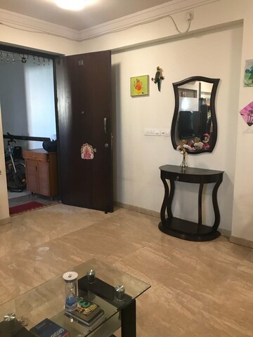 Living Room in 1 BHK Apartment at Hiranandani Estate Nova, Thane West – for Rent