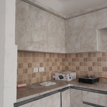 Kitchen in 2 BHK Apartment at Mahagun Mywoods, Sector 16c Greater Noida – for Rent