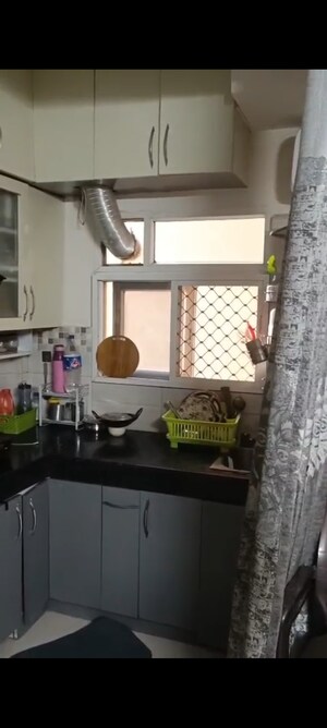 Kitchen in 1.5 BHK Apartment at Signature Global Orchard Avenue, Sector 93 – for Sale