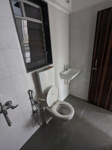 Bathroom in 1 BHK Apartment at Dharti Presidio, Malad West – for Rent