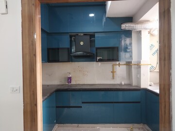 Kitchen in 2.5 BHK Apartment at Mahagun Mywoods II, Sector 16c Greater Noida – for Rent