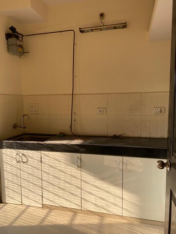 Kitchen in 1 BHK Apartment at Lalani Residency, Kavesar – for Rent