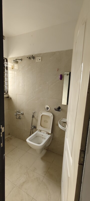 Bathroom in 1 BHK Apartment at Puranik City, Kasarvadavali – for Rent