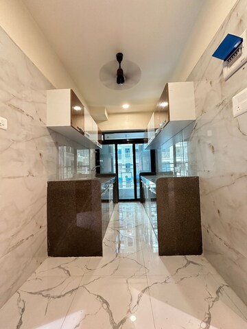 Kitchen in 1 BHK Apartment at Shellproof Gladiolus Tower, Vasai East – for Sale