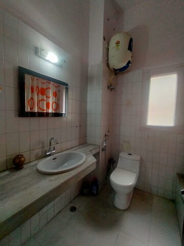 Bathroom in 3 BHK Apartment at Defence Colony – for Rent