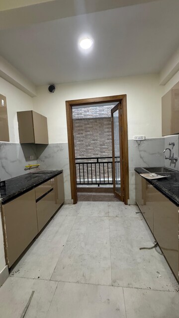 Kitchen in 1.5 BHK Builder Floor at Risland Sky Mansion, Chattarpur – for Rent