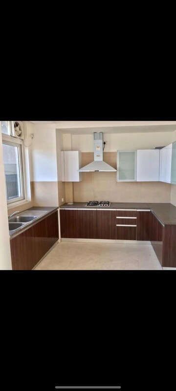 Kitchen in 3 BHK Apartment at Puri Diplomatic Greens Phase I, Sector 111 – for Rent