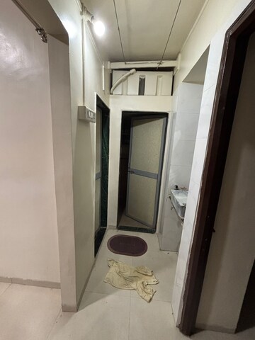 Building Lobby in 1 BHK Apartment at Wadgaon Sheri – for Rent