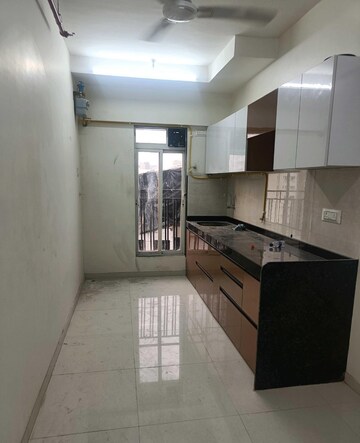 Kitchen in 2 BHK Apartment at Bini Winspace Amelio, Andheri West – for Rent