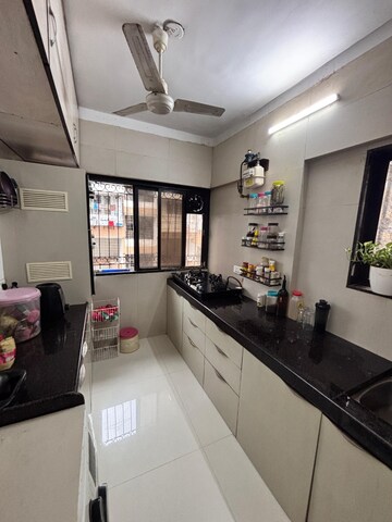 Kitchen in 3 BHK Apartment at Versova Cosmic Tower, Andheri West – for Rent
