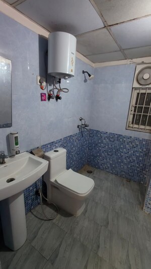 Bathroom in 3 BHK Apartment at Aims Golf City, Sector 75 – for Sale