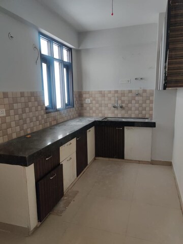 Kitchen in 2 BHK Apartment at Okay Plus Hare Krishna Homes, Mansarovar – for Sale