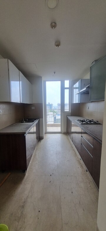 Kitchen in 3 BHK Apartment at Puri Diplomatic Greens Phase I, Sector 111 – for Rent