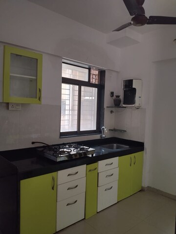 Kitchen in 2 BHK Apartment at Shree Satya Shankar Residency, Manpada – for Rent