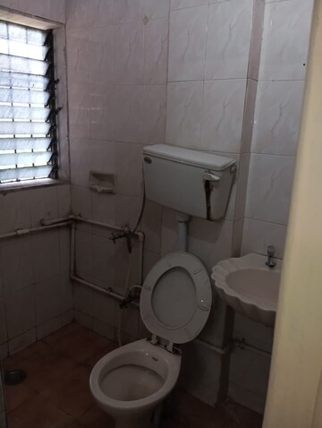 Bathroom in 1 BHK Apartment at Raunak Unnathi Woods Phase 4 And 5, Ghodbunder Road – for Rent