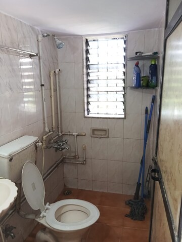 Bathroom in 1 BHK Apartment at Raunak Unnathi Woods Phase 4 And 5, Ghodbunder Road – for Rent