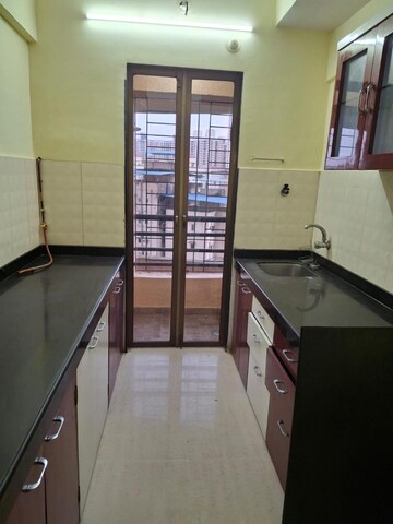 Kitchen in 3 BHK Apartment at Balaji Trinity Oasis, Bhayandarpada – for Sale