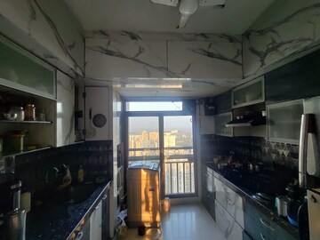 Kitchen in 3 BHK Apartment at Harmony Sky Suites, Ghodbunder Road – for Rent
