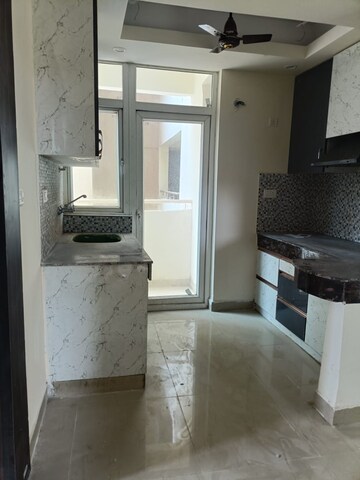 Kitchen in 2 BHK Apartment at Logix Blossom Greens, Sector 143 – for Rent