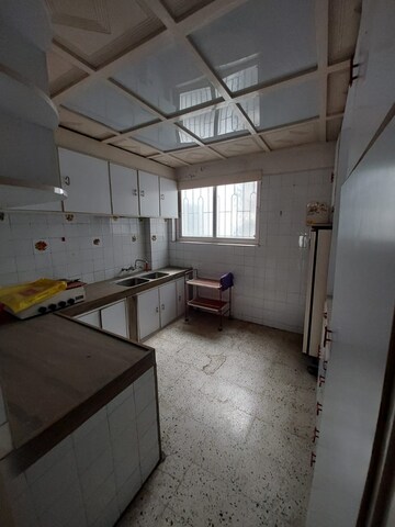 Kitchen in 3 BHK Apartment at Kumar Platinum, Camp – for Sale