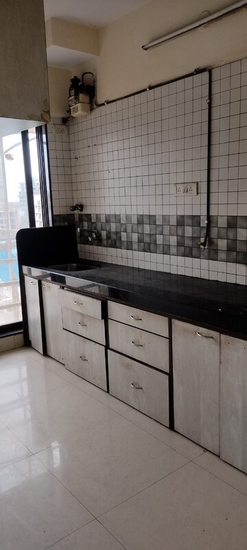 Kitchen in 2 BHK Apartment at Omkar Signet, Malad East – for Rent