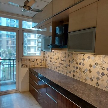 Kitchen in 3 BHK Apartment at JKG Palm Court, Sector 16c Greater Noida – for Sale